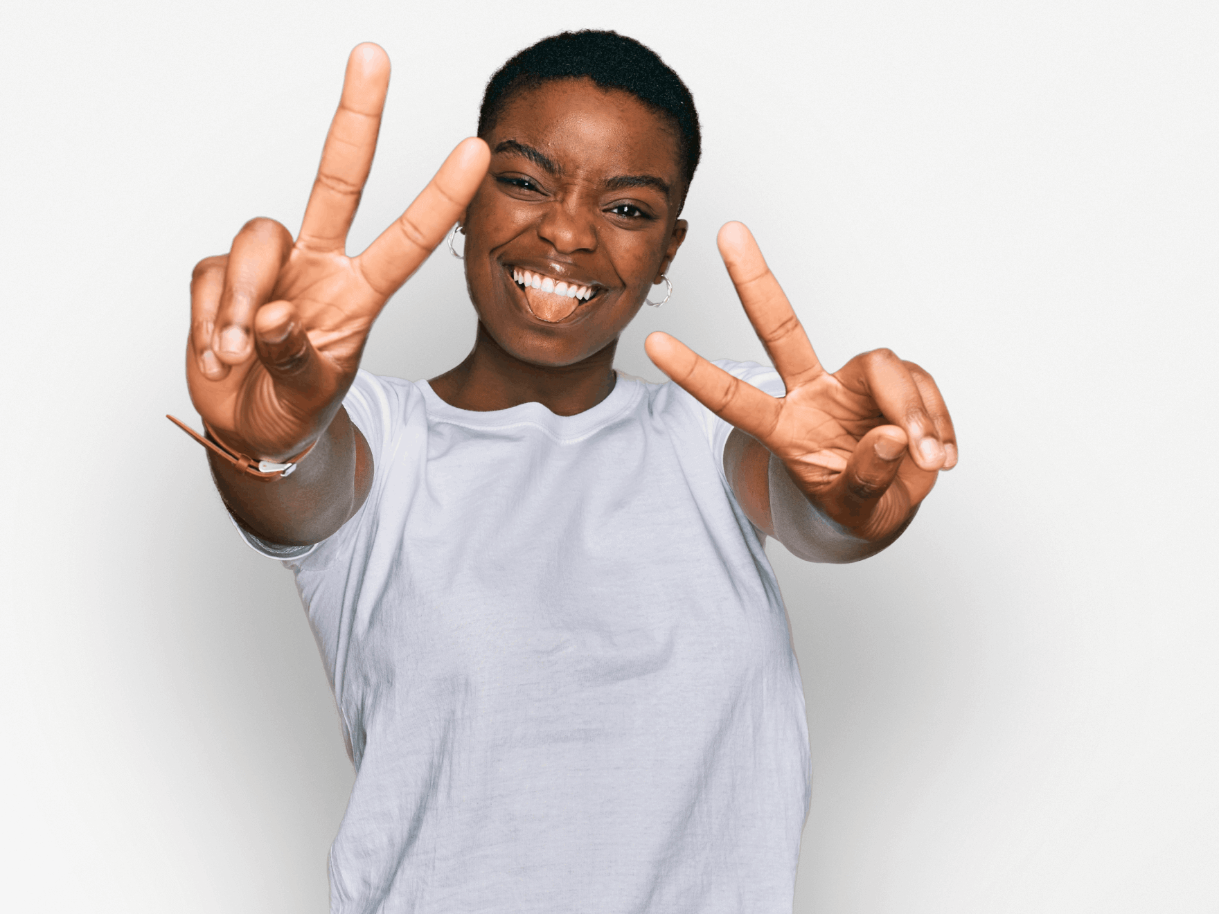 Woman smiling while making peace signs